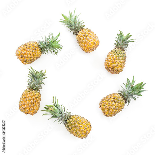 Food frame of pineapple fruits on white background. Flat lay, top view. Food concept with copy space
