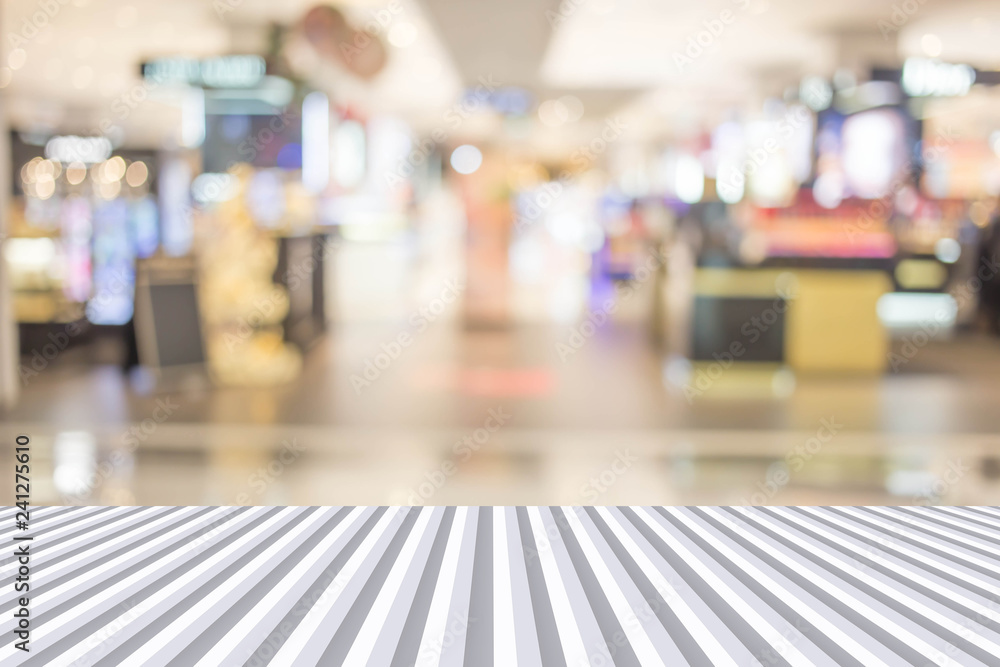 Abstract blur image of People walking at shopping mall or exhibition hall with bokeh for background usage .