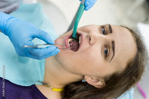 Patient in dentistry with stomatological tools  closeup