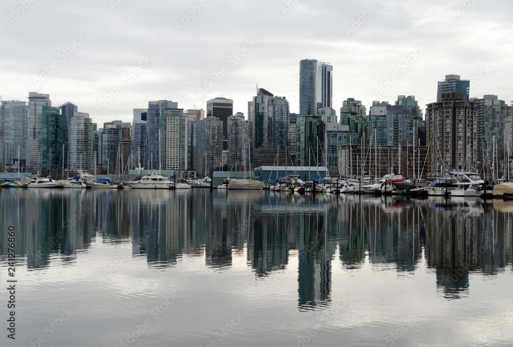 Looking at West Vancouver skyline from Stanley Park  across calm surface of Burrard inlet