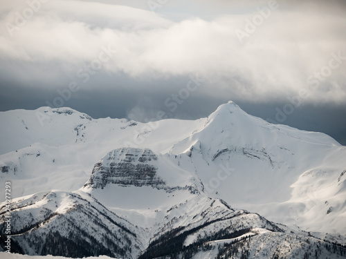 caucasus mountains high mountain peaks covered with snow and with clouds at winter day