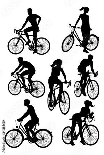 A set of bicycle cyclists riding their bikes in silhouette 