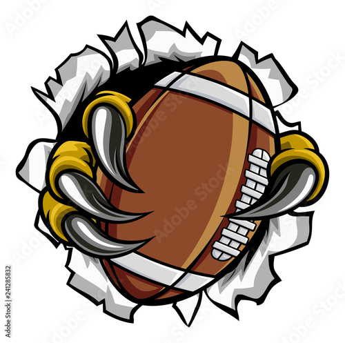 Eagle, bird or monster claw or talons holding an American football ball and tearing through the background. Sports graphic.