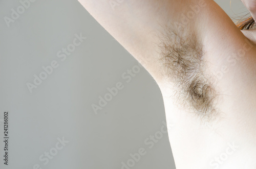 hairy woman's armpit, close-up, unshaven, a lot of hair on the armpit photo