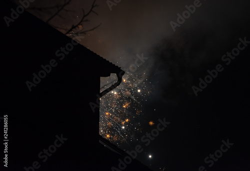 fireworks and smoke on the background of the night  misty sky