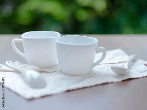 White ceramic cups on table