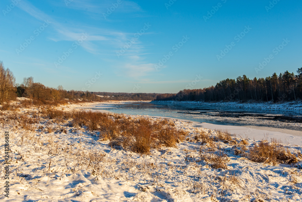 frozen ice and snow in river in winter