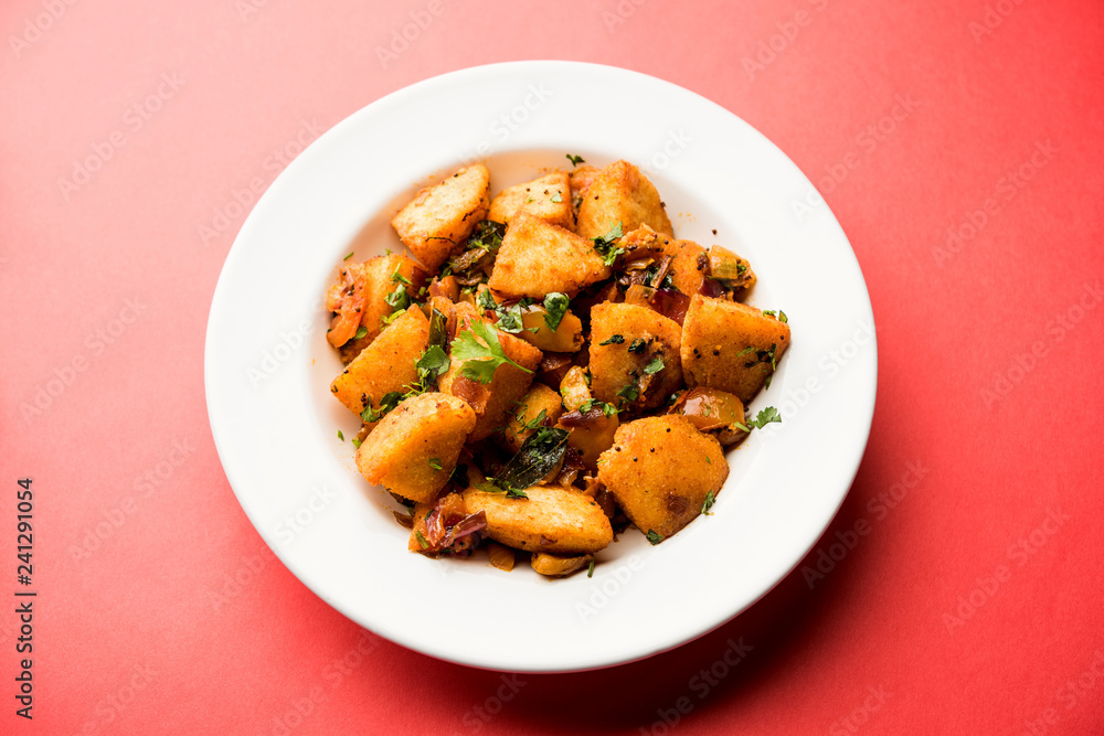 Masala fried Idlies or Idli fry - south indian Snack made using with leftover idly served with tomato ketchup. selective focus Masala fried Idlies or Idli fry - south indian Snack made using with leftover idly served with tomato ketchup. selective focus