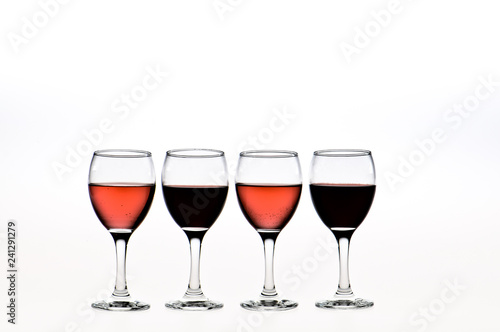 four glasses of red and pink wine