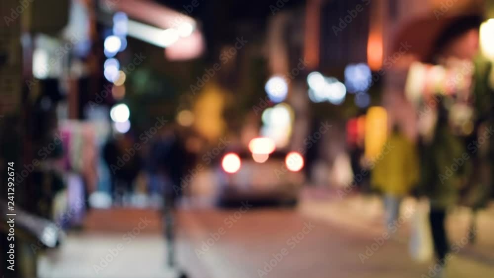 People walk around the city. Pedestrianized street. Blurred background. HD