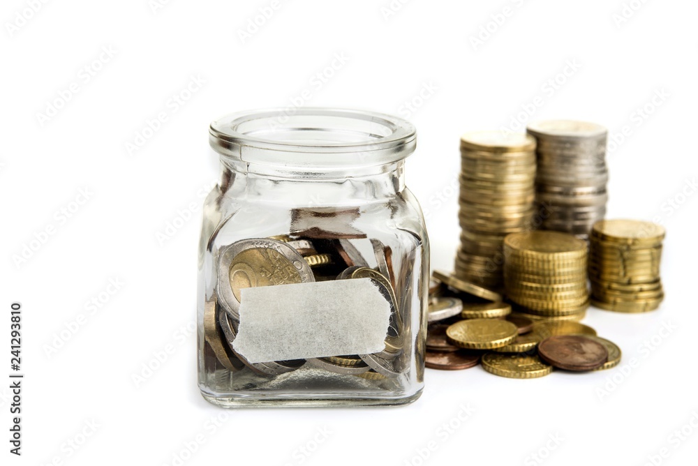 Full jar of coins with blank label. Savings concept Full jar of coins with blank label. Savings concept