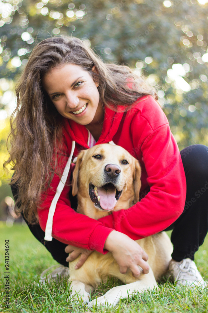 Young smiling woman with her cute dog Young smiling woman with her cute dog