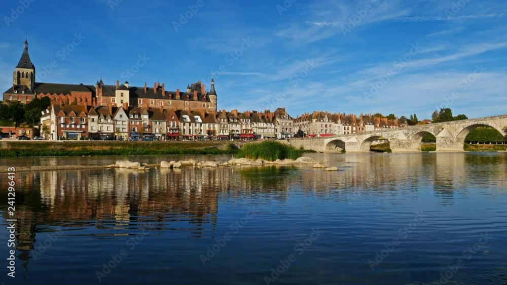 Gien, Loiret, France. The castle and the church overlooking the Loire river. Gien, Loiret, France. The castle and the church overlooking the Loire river.