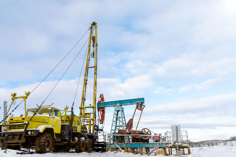 Mining and quarrying. Installations for the extraction of oil from the bowels of the Earth. Pumpjack is the overground drive for a reciprocating piston pump in an oil well. Mining and quarrying. Installations for the extraction of oil from the bowels of the Earth. Pumpjack is the overground drive for a reciprocating piston pump in an oil well.