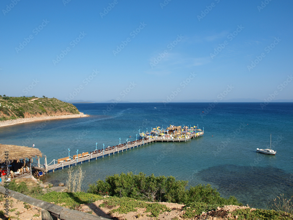 A jetty with bar leading out to sea in Altinkum Turkey