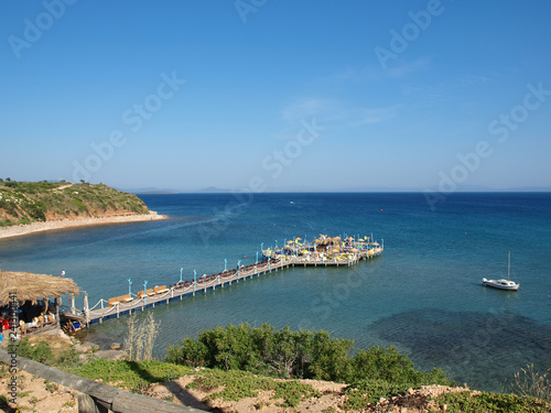 A jetty with bar leading out to sea in Altinkum Turkey