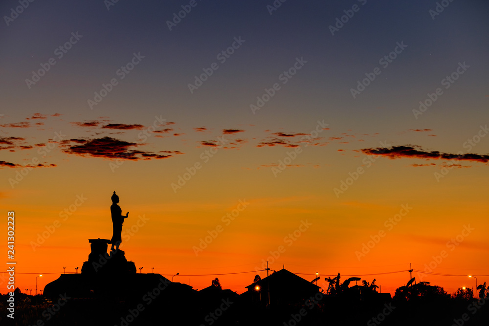 silhouette standing Buddha statue during sunrise