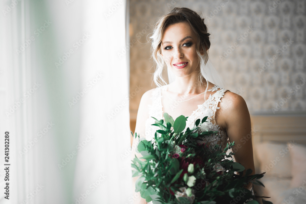 Portrait of beautiful bride with fashion veil at wedding morning Portrait of beautiful bride with fashion veil at wedding morning