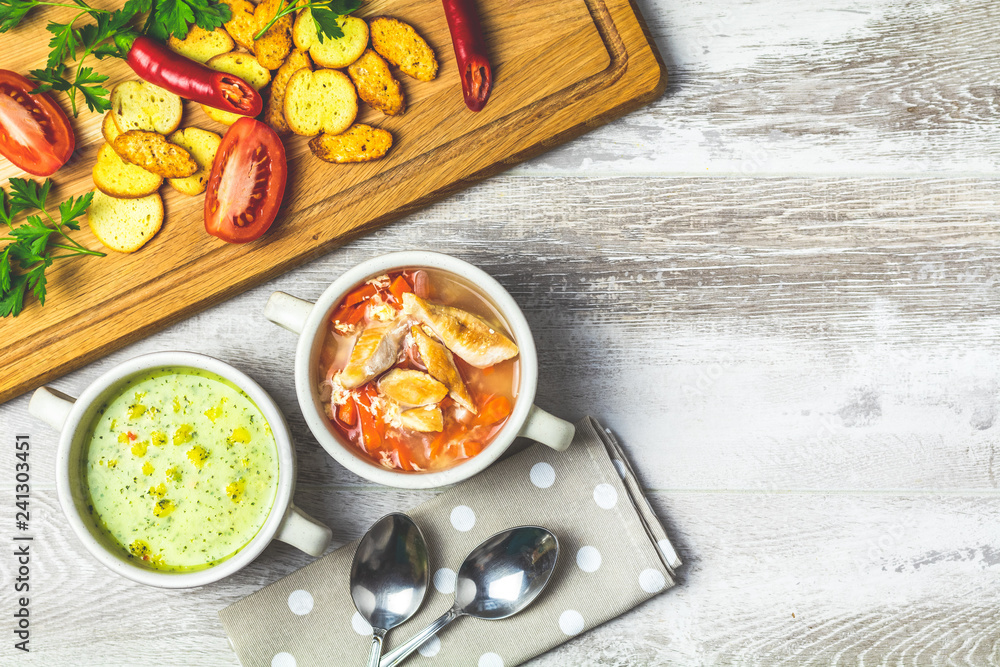 Vegetables soup with carrot, eggs and chicken, mushroom cream soup with herbs and crackers and ingredients Vegetables soup with carrot, eggs and chicken, mushroom cream soup with herbs and crackers and ingredients