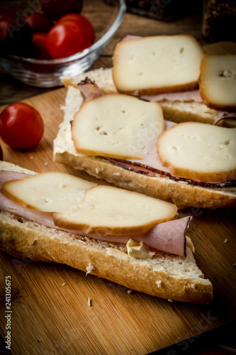 Sandwich with ham and smoked cheese.