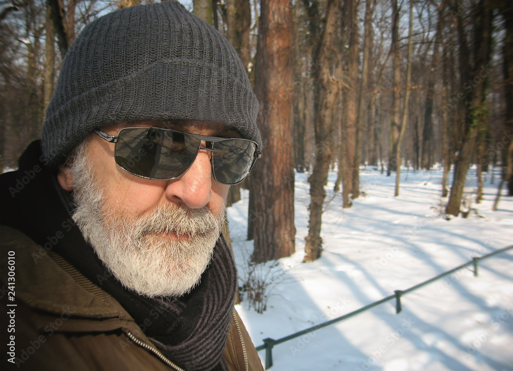 The man in the park in the snow, male model. The man in the park in the snow, male model.