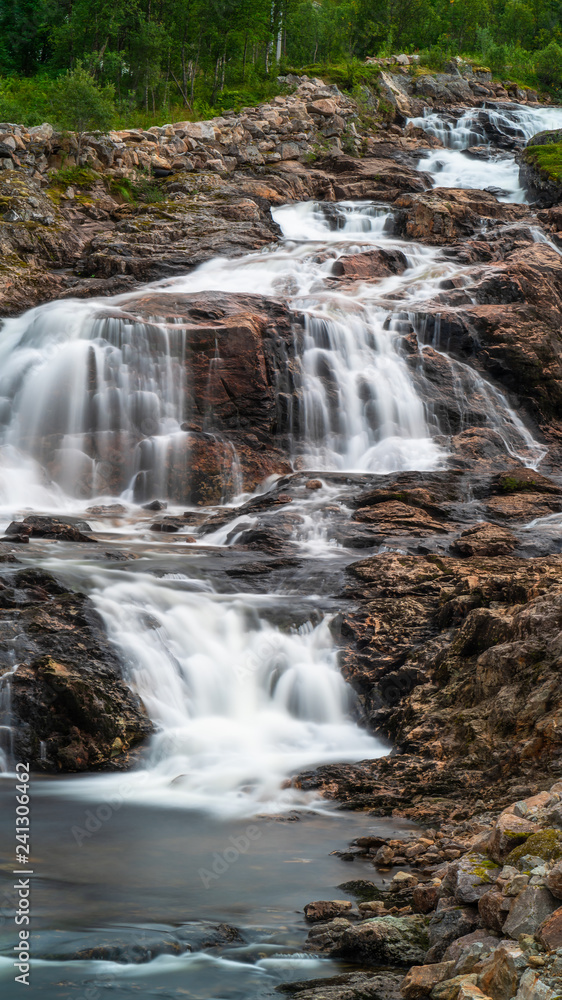A small waterfall near Ersfjorden in Norway A small waterfall near Ersfjorden in Norway