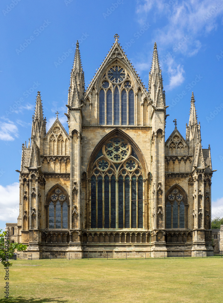 Gothic cathedral in Lincoln, Lincolnshire, England, UK. Presbytery with rosettes and lancet windows with stained glass