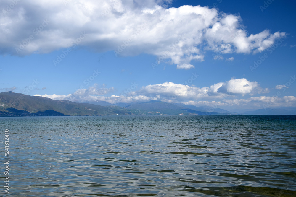 Obraz premium Landscape of Ohrid lake with mountain background. Pogradec, Tushemisht, Albania.
