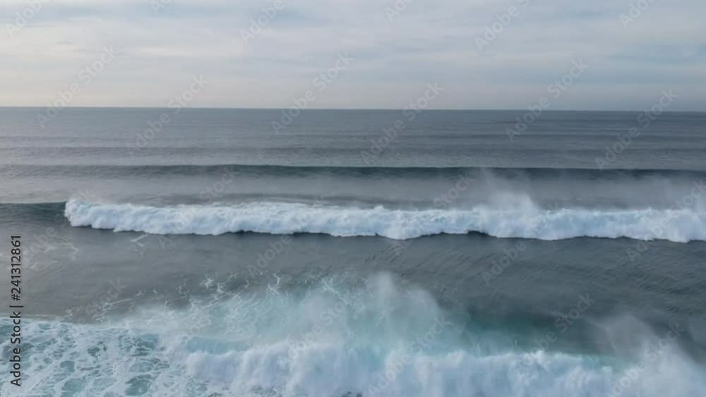 Perfect waves in a surf spot at the sunset. Aerial view. Drone shot. Perfect waves in a surf spot at the sunset. Aerial view. Drone shot.