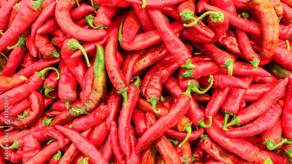 Top view on red pointed peppers displayed in food market