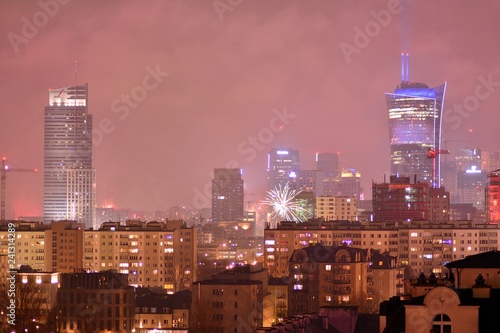 Downtown city at night. New Year s Eve fireworks