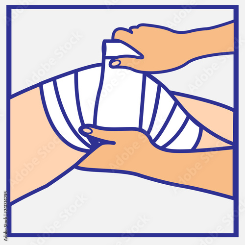 Person’s hands wrapping a bandage on an injured knee