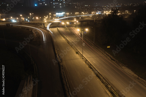 Autumn night light trails at entrance of the city.