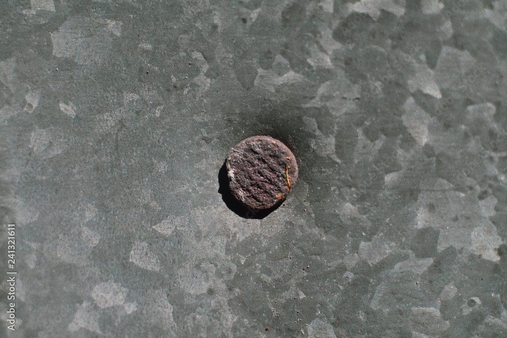 Old iron galvanized roof and rusty nail. Old iron galvanized roof and rusty nail.