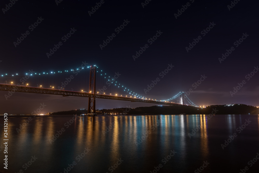 25 april bridge illuminated on a winter night