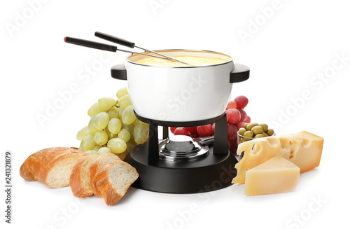 Composition with pot of delicious cheese fondue on white background