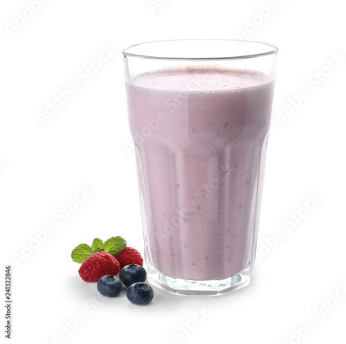 Glass of protein shake and berries isolated on white