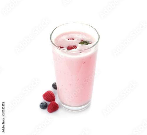 Glass of protein shake and berries isolated on white