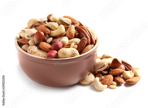 Bowl with mixed organic nuts on white background