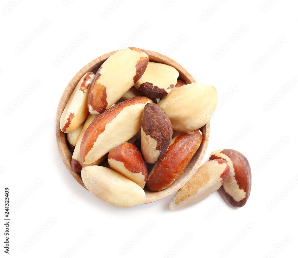 Wooden bowl with Brazil nuts on white background, top view Wooden bowl with Brazil nuts on white background, top view