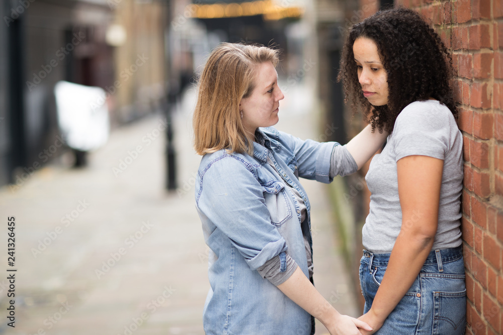 Lesbian woman conforting her girlfriend