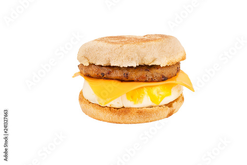 Close up on a sandwich breakfast isolated on white background. English muffin, egg, cheese, lettuce and sausage.