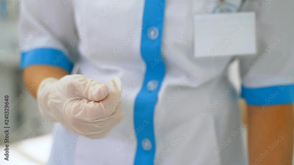 Medical worker opens the ampoule.