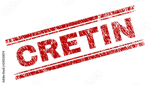 CRETIN seal print with grunge texture. Red vector rubber print of CRETIN text with dust texture. Text title is placed between double parallel lines.