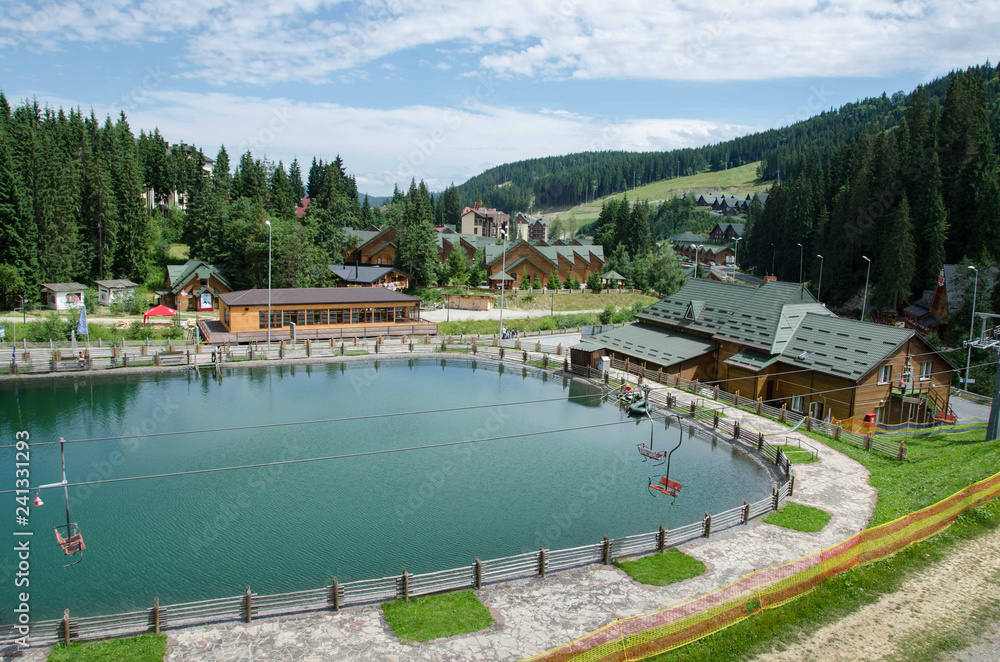 Naklejka premium Holiday in the mountain resort in summer