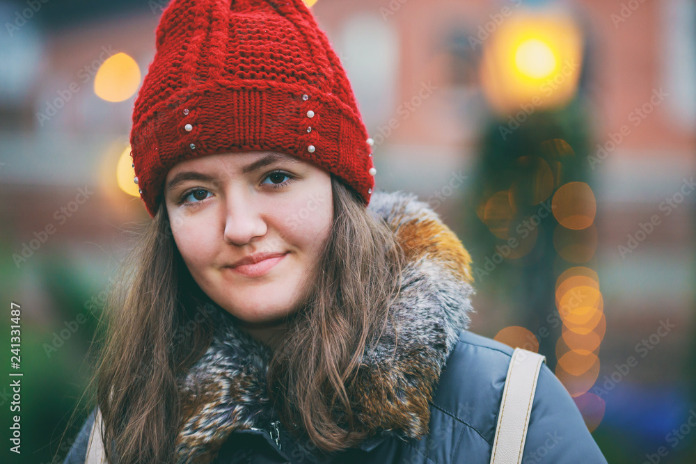 Close up portrait of a beautiful smiling girl with brown hair colorful lights bokeh Close up portrait of a beautiful smiling girl with brown hair colorful lights bokeh