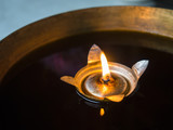 Candle floating on water close up