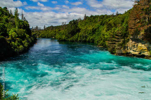 Scenic landscape view of turquoise water of Waikato river and Huka Falls,most popular natural tourist attraction/destination. Great lake Taupo,North Island, New Zealand. Summer active holiday concept.