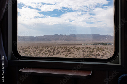 View of the Kumtag Desert in the Gansu Province from the window of a train, in China. photo