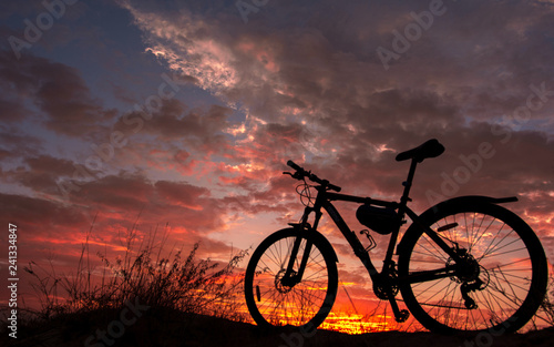 Fototapeta Naklejka Na Ścianę i Meble -  bike in the background fire sunset.